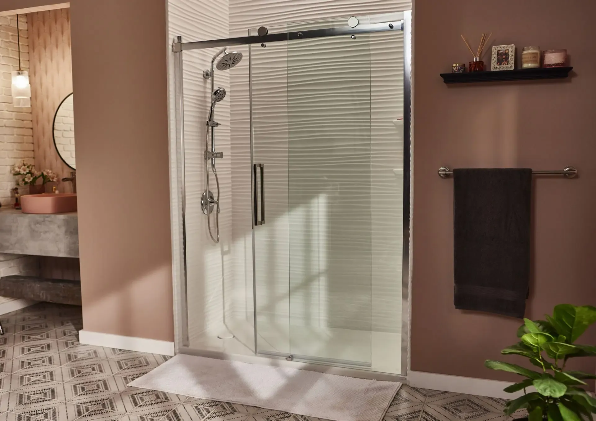 Custom walk-in glass shower with chrome fixtures