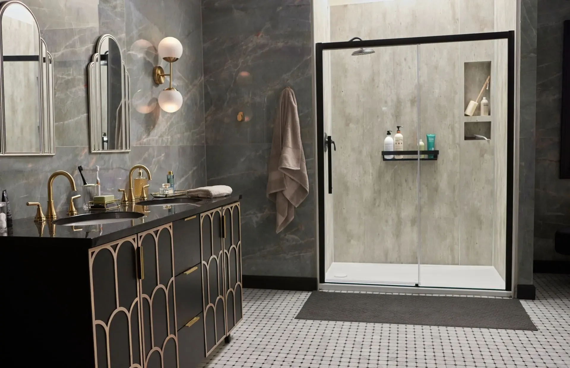 Modern bathroom with dark marble and gold fixtures